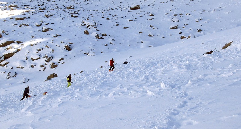 
              In this Monday, Oct. 9, 2017, photo provided by the The Gallatin National Forest Avalanche Center, searchers probe the lower portion of an avalanche debris field for a missing skier on Imp Peak in the southern Madison Range in southwestern Montana. The body of Inge Perkins was recovered after two skiers triggered the weekend avalanche that fully buried Perkins and partially buried renowned mountaineer Hayden Kennedy. After losing his girlfriend in the avalanche, Kennedy "chose to end his life" the following day, his family said Tuesday. (The Gallatin National Forest Avalanche Center via AP)
            