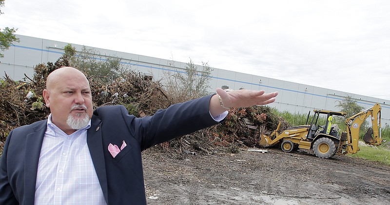 
              ADVANCE FOR USE SUNDAY, OCT. 15, 2017 AND THEREAFTER-In this Tuesday, Sept. 26, 2017 photo, Sweetwater, Fla. Mayor Orlando Lopez talks about a temporary holding area for debris caused by Hurricane Irma. The Miami suburb was flooded in 1999 by a hurricane and again in 2000 by more storms. It received $2 million from FEMA for debris removal and repairs to public facilities. More than a decade later, FEMA demanded the money back, citing a lack of documentation for the costs. (AP Photo/Alan Diaz)
            