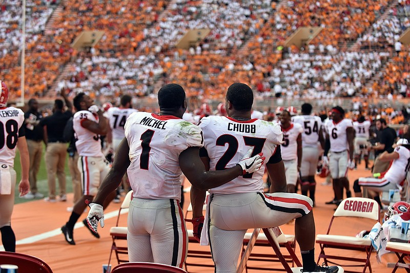 Georgia senior running backs Sony Michel and Nick Chubb talk on the sideline during the 41-0 win at Tennessee on Sept. 30.