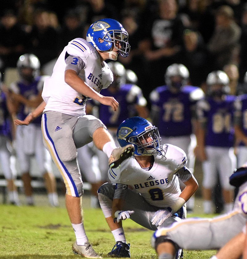 Bledsoe County kicker Gabe Boring (3) attempts a field goal from the hold of Skylar Standefer (8).  The Bledsoe County Warriors visited the Sequatchie County Indians in TSSAA football action Saturday September 25, 2015.