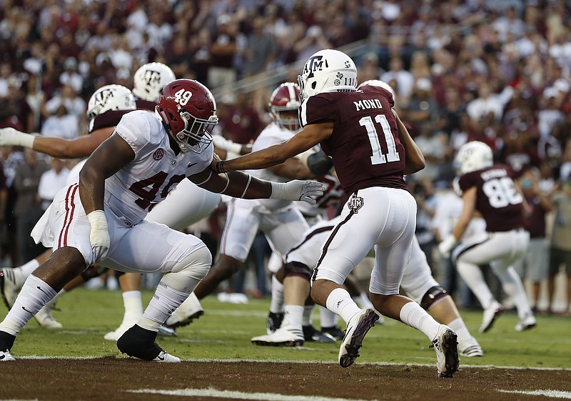 Alabama defensive lineman Isaiah Buggs closes in on Texas A&M quarterback Kellen Mond during last Saturday night's 27-19 win by the Crimson Tide.