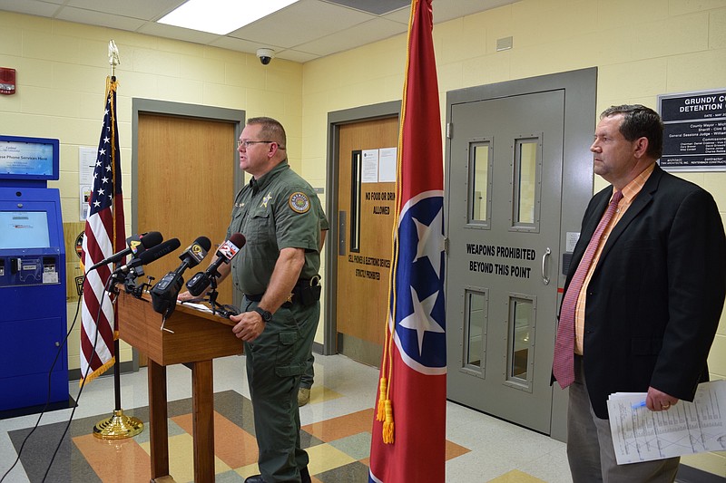 Grundy County Sheriff Clint Shrum speaks to media on Thursday, Oct. 12, 2017, at the Grundy County Sheriff's Office in Altamont, Tenn., on an investigation into a "hazing" incident that happened Wednesday at Grundy County High School's football field house. At right, 12th Judicial District Assistant District Attorney David McGovern listens to Shrum and questions from reporters.