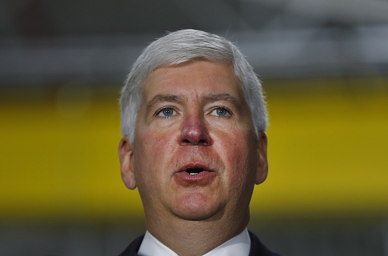
              FILE - In this Sept. 18, 2017 file photo, Michigan Gov. Rick Snyder speaks at American Axle & Manufacturing in Auburn Hills, Mich. Gov. Snyder is sticking by his congressional testimony about when he learned about a fatal outbreak of Legionnaires' disease during the Flint water crisis, despite a senior aide's new disclosure that he informed the Republican governor weeks earlier. Some Democrats in Congress are pouncing on the conflict and urging the U.S. House Oversight and Government Reform Committee to investigate. (AP Photo/Paul Sancya, File)
            