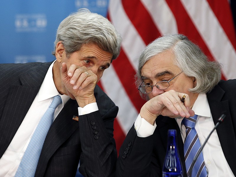 
              FILE - In this May 4, 2016 file photo, Secretary of State John Kerry, left, speaks with Secretary of Energy Ernest Moniz at the State Department in Washington. Former Obama administration officials who played central roles in brokering the Iran nuclear agreement are scheduled to brief congressional Democrats on the merits of the international accord as President Donald Trump prepares to announce a decision that could lead to an unraveling of the pact.  (AP Photo/Alex Brandon)
            