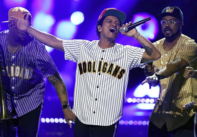 
              FILE - In this Sunday, June 25, 2017, file photo, Bruno Mars performs "Perm" at the BET Awards at the Microsoft Theater in Los Angeles. Mars is the top nominee with eight nods at the American Music Awards, while The Chainsmokers, Drake, Kendrick Lamar, Ed Sheeran and The Weeknd all earned five nominations each. The show will broadcast live from the Microsoft Theater in Los Angeles on Nov. 19 at 8:00 p.m. Eastern on ABC.  (Photo by Matt Sayles/Invision/AP, File)
            