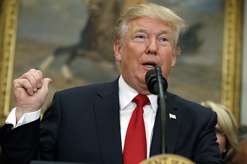 
              President Donald Trump speaks before signing an executive order on health care in the Roosevelt Room of the White House, Thursday, Oct. 12, 2017, in Washington. (AP Photo/Evan Vucci)
            