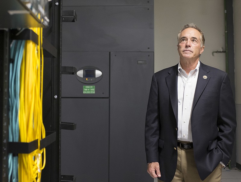 
              In this May 27th, 2015, photo, Republican Rep. Chris Collins visits to a Yahoo! datacenter in Lockport, N.Y. Congressional investigators say there is a "substantial reason to believe" Collins of New York shared material, non-public information about a drug company he had a major financial stake in and took official actions to assist the company. (Joed Viera/The Union-Sun & Journal via AP)
            