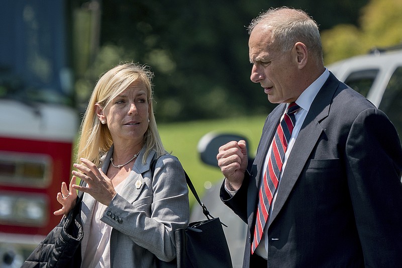 
              In this Aug. 22, 2017 photo, White House Chief of Staff John Kelly and Deputy Chief of Staff Kirstjen Nielsen speak together as they walk across the South Lawn of the White House in Washington. President Donald Trump is expected to nominate Kirstjen Nielsen as his next Secretary of Homeland Security. That’s according to three people familiar with decision. They spoke on condition of anonymity in order to discuss deliberations before a formal announcement. Nielsen was former DHS Secretary John Kelly’s deputy when he served in that role and moved with Kelly to the White House when he was tapped to be Trump’s chief of staff.   (AP Photo/Andrew Harnik)
            