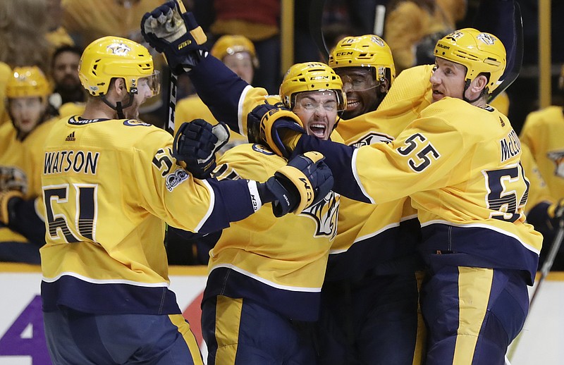 Nashville Predators defenseman Samuel Girard, second from left, celebrates with Austin Watson (51), P.K. Subban (76) and Cody McLeod (55) after scoring a goal against the Dallas Stars in the second period of an NHL hockey game Thursday, Oct. 12, 2017, in Nashville, Tenn. (AP Photo/Mark Humphrey)
