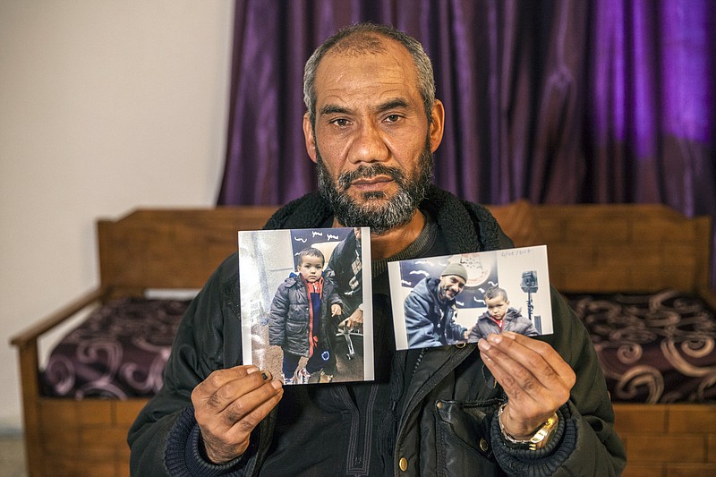 
              FILE - In this Wednesday, Feb. 3, 2017 file photo, taken in Tunis, Tunisia, Faouzi Trabelsi shows a photo of himself posing with his grandson, Tamim Jandoubi, who has been trapped in a prison in Libya since his parents, both Tunisians who left home to join the Islamic State group, died in an American airstrike in February 2016. A 3-year-old Tunisian orphan whose parents left home to join the Islamic State group has returned to his grandfather's custody after over a year in a Libyan prison. (AP Photo/Ons Abid, File)
            