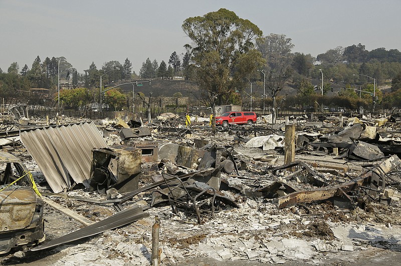 
              Shown are the remains of where Linda Tunis lived at the Journey's End mobile home park Wednesday, Oct. 11, 2017, in Santa Rosa, Calif. Jessica Tunis is searching for her missing mother, Linda Tunis, who was living at the mobile home park when the wildfires struck. (AP Photo/Eric Risberg)
            