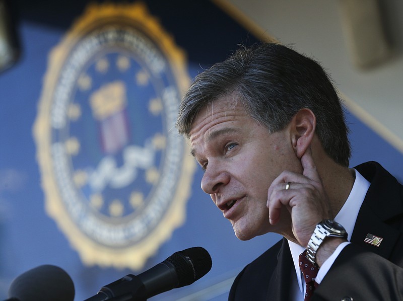 
              FBI director Christopher Wray strains to hear a question as he speaks to reporters after a dedication ceremony for the new building that will house the bureau's Atlanta Field Office on Thursday, Oct. 12, 2017, in Atlanta. (AP Photo/John Bazemore)
            