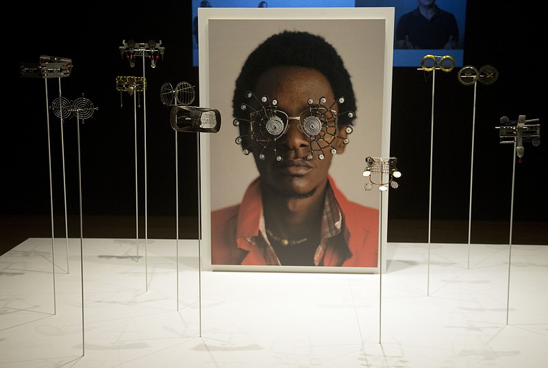 
              Wire eyeglasses are shown at the High Museum of Art Wednesday, Oct. 11, 2017, in Atlanta. "Making Africa: A Continent of Contemporary Design" opens Saturday at Atlanta's High Museum of Art. It defines design broadly and delves into the continent's diversity and vibrancy through more than 200 works by more than 120 artists from 22 countries. (AP Photo/John Bazemore)
            