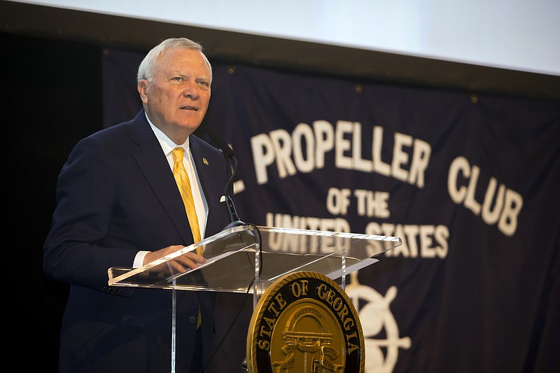 In this photo provided by the Georgia Port Authority, Georgia Gov. Nathan Deal provides opening comments for the Savannah State of the Port event, Thursday, Oct. 12, 2017, in Savannah, Ga. Deal says the federal government needs to "step up" and increase funding to deepen the busy shipping channel to the Port of Savannah. (Stephen Morton/Georgia Port Authority via AP)