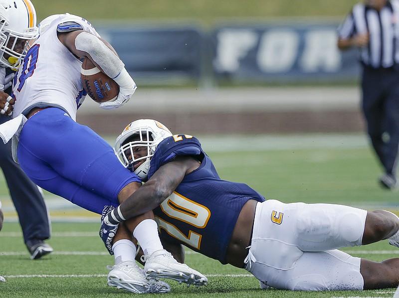 White team linebacker Dale Warren (20) deflects a pass by blue team 
quarterback Alejandro Bennifield during the UTC spring football game at Finley Stadium on April 23, 2016.