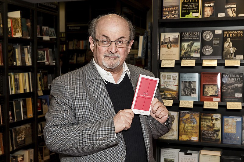 
              FILE - In this June 6, 2017 file photo, author Salman Rushdie poses for photographers at a signing for his new book 'Home', in London.   Rushdie  and Patti Smith will make a joint appearance Dec. 4 for the 5th annual Chairman’s Evening of the MacDowell Colony. MacDowell, based in New Hampshire and one of the country’s oldest arts colonies, told The Associated Press on Friday, Oct. 13  that the event will take place at the Whitney Museum in Manhattan.  (Photo by Grant Pollard/Invision/AP)
            