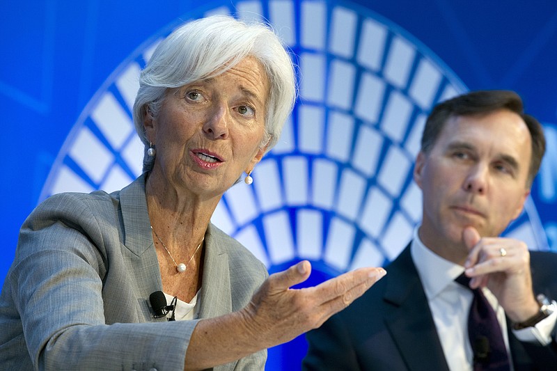 
              International Monetary Fund (IMF) Managing Director Christine Lagarde accompanied by Canada Finance Minister William Morneau, speaks during a Global Economy debate in the sidelines of the World Bank/IMF Annual Meetings in Washington, Thursday, Oct. 12, 2017. ( AP Photo/Jose Luis Magana)
            