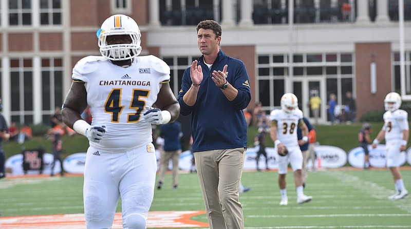 UTC's Chris Jones and coach Tom Arth on Oct. 14, 2017 at Mercer. (Ben Dodds/UTC Athletics)