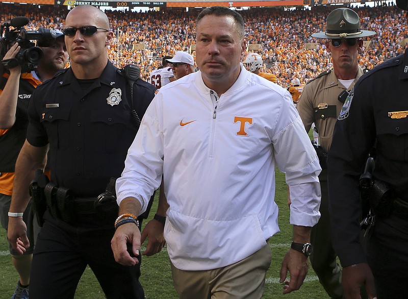 Tennessee coach Butch Jones makes his way off the field after the Volunteers' 15-9 loss to South Carolina at Neyland Stadium on Saturday.