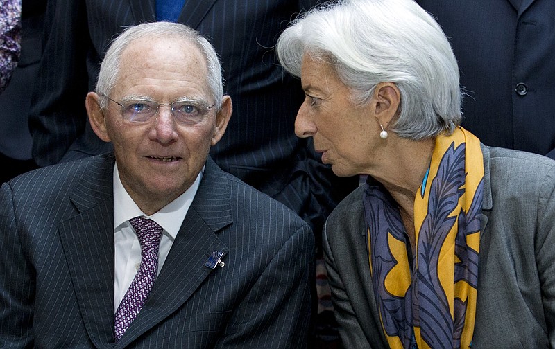 
              Germany Finance Minister Wolfgang Schäuble speaks with International Monetary Fund (IMF) Managing Director Christine Lagarde during the Monetary Fund (IMF) Governors group photo at the World Bank/IMF Annual Meetings in Washington, Saturday, Oct. 14, 2017. ( AP Photo/Jose Luis Magana)
            