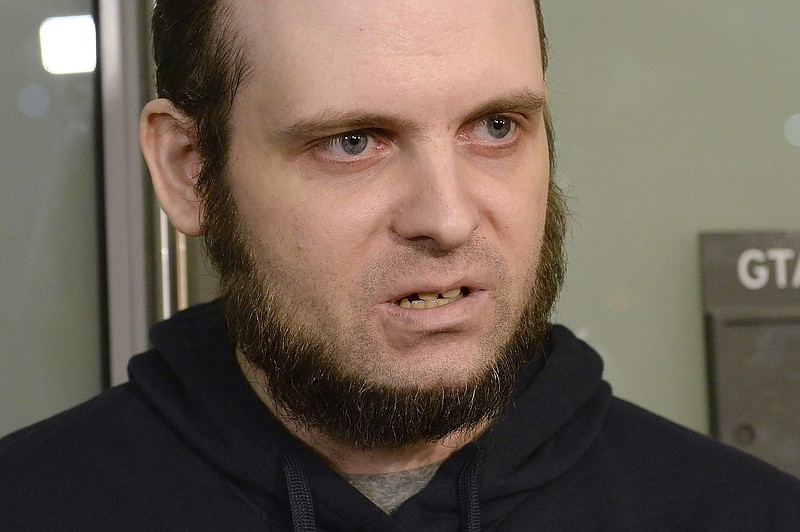 
              Joshua Boyle speaks to members of the media at Toronto's Pearson International Airport on Friday, Oct. 13, 2017. Boyle, his wife Caitlin Coleman, and their three children landed in Canada after they were kidnapped in Afghanistan while on a backpacking trip and held hostage for five years by the Taliban-linked Haqqani network. (Nathan Denette/The Canadian Press via AP)
            