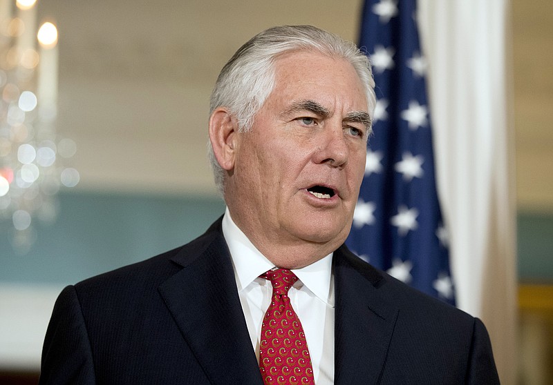 
              FILE - In a Friday, Oct. 13, 2017 file photo, Secretary of State Rex Tillerson answers a reporters question while greeting Organization of American States Secretary-General Luis Almagro at the State Department, in Washington. Tillerson said Sunday, Oct. 15, in a television interview that President Donald Trump wants a diplomatic solution to the North Korean crisis and is not hankering for war with the nuclear-armed nation, despite past tweets that America’s chief envoy was ``wasting his time’’ trying to negotiate with the North’s leader.(AP Photo/Andrew Harnik, File)
            