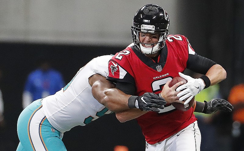 Miami defensive end Cameron Wake sacks Atlanta's Matt Ryan during the second half of Sunday's game at Mercedes-Benz Stadium. The Dolphins rallied from a 17-0 halftime deficit to win 20-17.