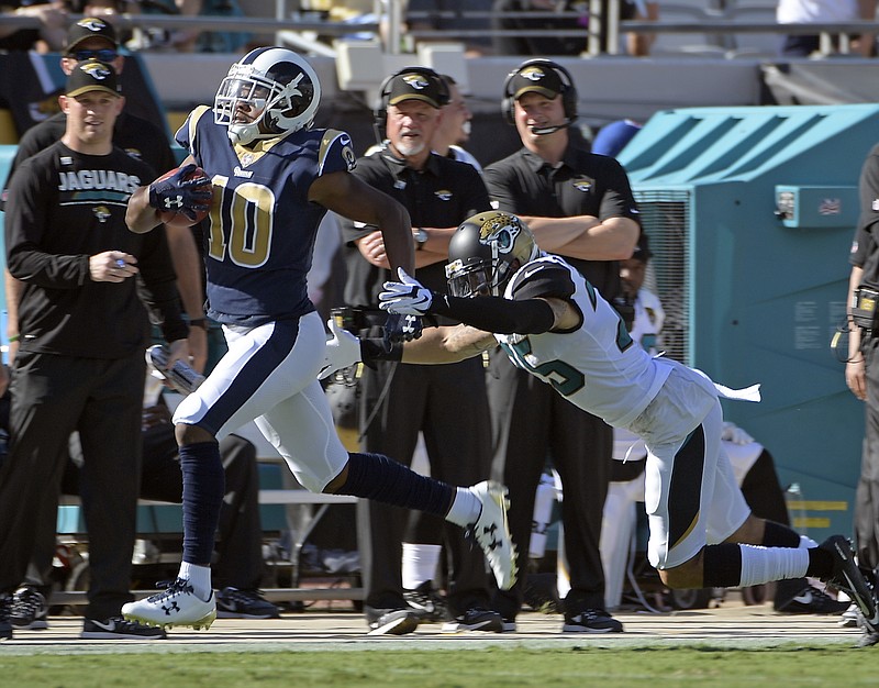 Los Angeles Rams' Pharoh Cooper, left, runs for a touchdown on a kickoff past Jacksonville Jaguars safety Peyton Thompson during the first half of an NFL football game, Sunday, Oct. 15, 2017, in Jacksonville, Fla. (AP Photo/Phelan M. Ebenhack)
