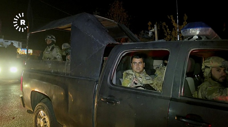 
              This image made from a video provided by RUDAW TV shows what the Irbil-based Kurdish broadcaster says are Peshmerga fighters and volunteers arriving on military trucks in Kirkuk, Iraq, Monday, Oct. 16, 2017. (RUDAW TV via AP)
            