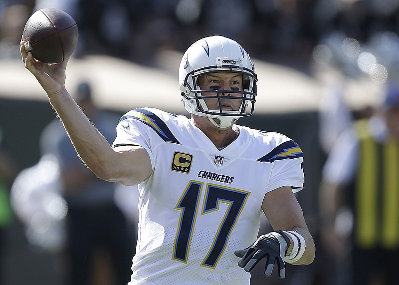 
              Los Angeles Chargers quarterback Philip Rivers (17) passes against the Oakland Raiders during the first half of an NFL football game in Oakland, Calif., Sunday, Oct. 15, 2017. (AP Photo/Ben Margot)
            