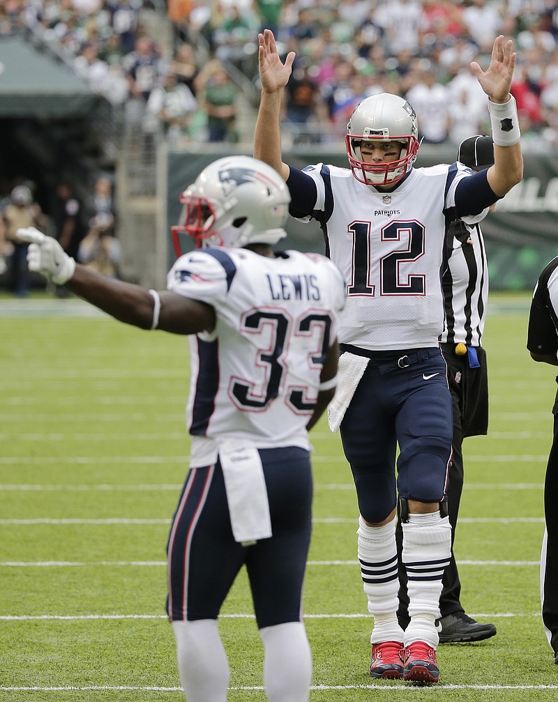 
              New England Patriots quarterback Tom Brady (12) and Dion Lewis (33) celebrate after a touchdown pass to Rob Gronkowski during the second half of an NFL football game against the New York Jets, Sunday, Oct. 15, 2017, in East Rutherford, N.J. (AP Photo/Seth Wenig)
            