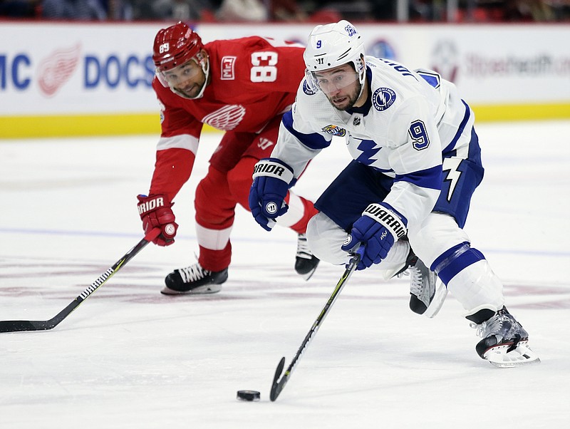 
              Tampa Bay Lightning center Tyler Johnson (9) drives down the ice past Detroit Red Wings defenseman Trevor Daley (83) for an unassisted goal during the first period of an NHL hockey game Monday, Oct. 16, 2017, in Detroit. (AP Photo/Duane Burleson)
            