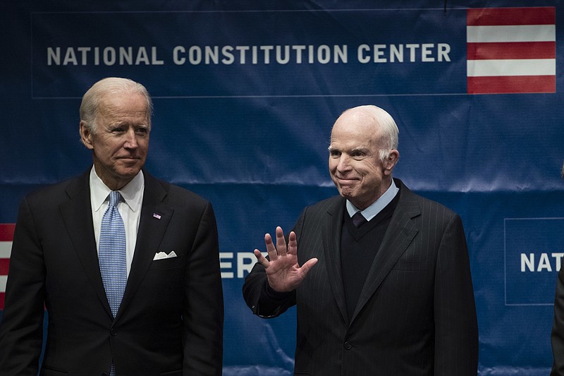 
              Sen. John McCain, R-Ariz., right, accompanied by Chair of the National Constitution Center's Board of Trustees, former Vice President Joe Biden, waves as he takes the stage before receiving the Liberty Medal in Philadelphia, Monday, Oct. 16, 2017. The honor is given annually to an individual who displays courage and conviction while striving to secure liberty for people worldwide. (AP Photo/Matt Rourke)
            