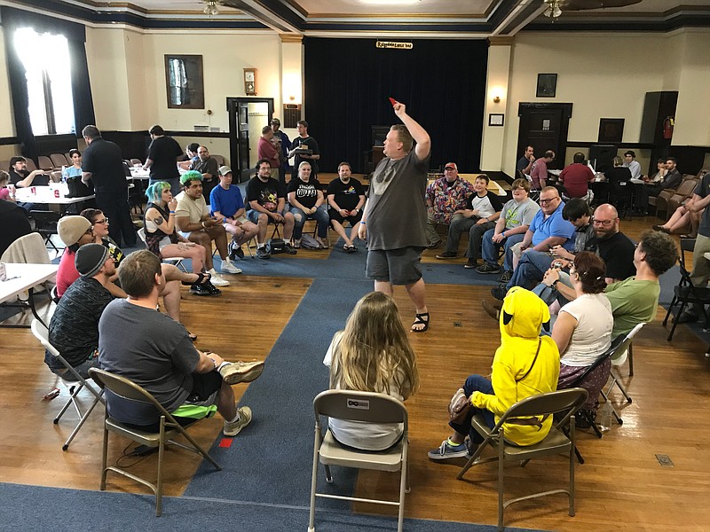 Chris Peyton, center, hosts a game of Werewolf, a communal, interactive party game, during the first Chattanooga Tabletop Game Fest in April. Peyton hosts a monthly game of Werewolf on the first Sunday of every month at Infinity Flux in Hixson. (Contributed Photo)