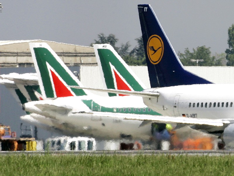 
              -FILE - In this April 23, 2008 file photo, Lufthansa and Alitalia jetliners are parked at the Milan Linate airport, Italy. The Italian daily Corriere della Sera says Lufthansa is preparing a 500 million-euro ($590 million) bid for large parts of bankrupt Italian carrier Alitalia, including the fleet, pilots, air crew and air slots. Alitalia, which declared bankruptcy in May, faces a Monday deadline for binding offers. (AP Photo/Antonio Calanni/Files)
            