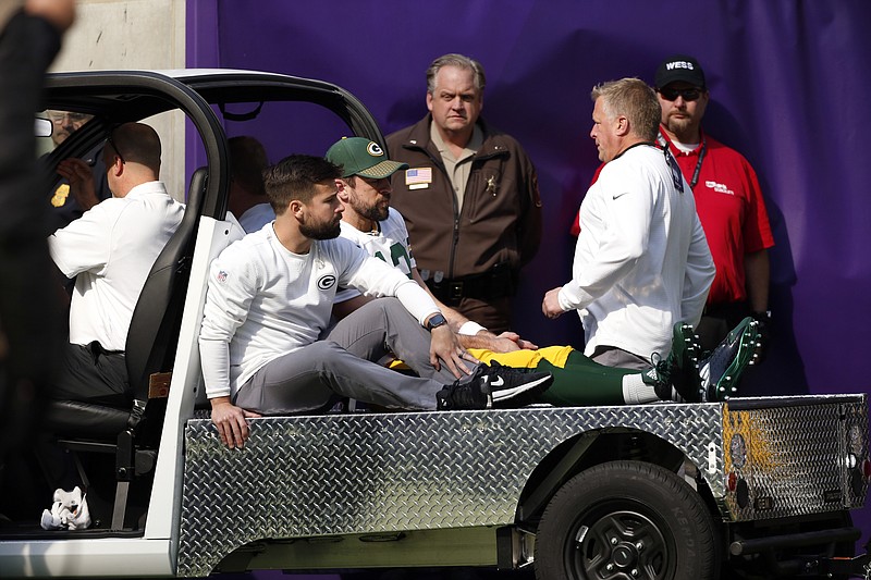 
              Green Bay Packers quarterback Aaron Rodgers (12) rides a cart to the locker room after being injured against the Minnesota Vikings in the first half of an NFL football game in Minneapolis, Sunday, Oct. 15, 2017. (AP Photo/Bruce Kluckhohn)
            