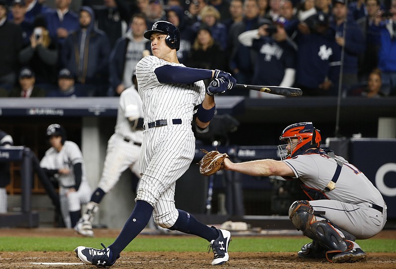 
              New York Yankees' Aaron Judge hits a three-run home run during the fourth inning of Game 3 of baseball's American League Championship Series against the Houston Astros Monday, Oct. 16, 2017, in New York. (AP Photo/Kathy Willens)
            