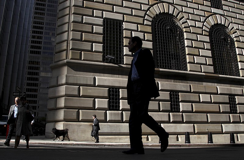 
              FILE - In this Thursday, Oct. 18, 2012, file photo, pedestrians walk past the Federal Reserve Bank of New York, in New York. Manufacturing activity in New York picked up in October 2017, expanding at the fastest pace in three years, according to information released Monday, Oct. 16, 2017, by the Federal Reserve Bank of New York. (AP Photo/Seth Wenig, File)
            