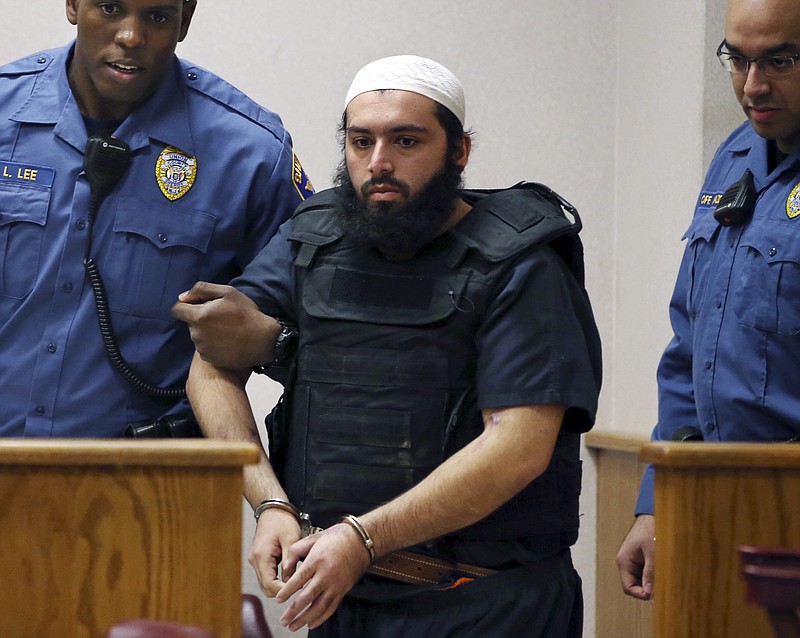 
              FILE - In this file photo from Tuesday, Dec. 20, 2016, Ahmad Khan Rahimi, the man accused of setting off bombs in New Jersey and New York in September is led into court in Elizabeth, N.J. Prosecutors said the case against Rahimi relies on video from security cameras in storefronts and businesses all over New Jersey and New York. (AP Photo/Mel Evans, File)
            