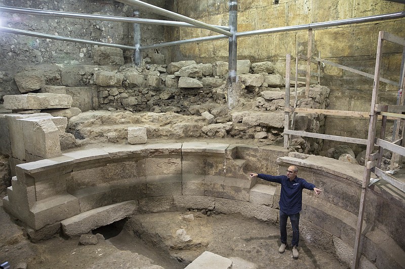
              Israel's Antiquities Authority's  Joe Uziel stands in an ancient Roman theater-like structure in the Western Wall tunnels in Jerusalem's old city, Monday, Oct. 16, 2017. Israeli archaeologists have announced the discovery of the first known Roman-era theater in Jerusalem's Old City, a unique 1,800-year-old structure abutting the Western Wall that is believed to have been built during Roman Emperor Hadrian's reign. (AP Photo/Sebastian Scheiner)
            