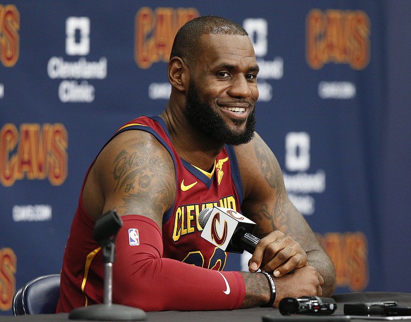 
              FILE - This Sept. 25, 2017 file photo shows Cleveland Cavaliers' LeBron James answering questions during the NBA basketball team media day in Independence, Ohio. James tested his injured left ankle during a portion of practice Sunday, Oct. 15, 2017 but it’s still not known if he’ll play in Cleveland’s season opener. (AP Photo/Ron Schwane, file)
            