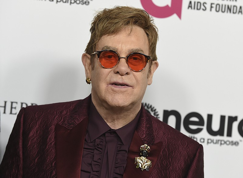 
              FILE - In this March 25, 2017 file photo, Elton John arrives at Elton John's 70th Birthday and 50-Year Songwriting Partnership with Bernie Taupin celebration in Los Angeles. John announced Monday, Oct. 16, 2017, that his show, "The Million Dollar Piano" at Caesars Palace in Las Vegas will be ending in May 2018 after more than 200 performances. (Photo by Jordan Strauss/Invision/AP, File)
            