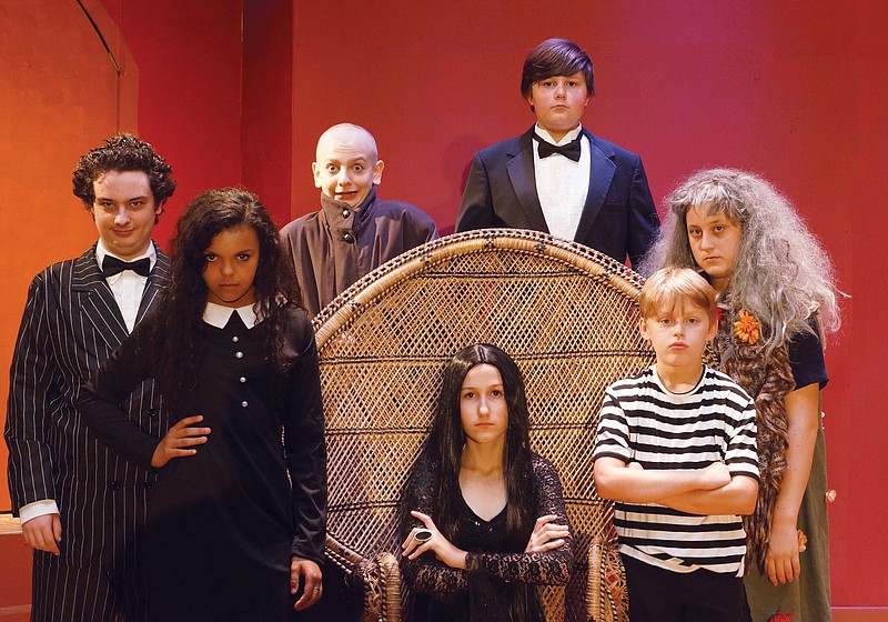 From left are Hunter Landreth (Gomez), Olivia Kelly (Wednesday), Benjamin Brown (Uncle Fester), Gabrielle Stoll (Morticia), Harrison Stoll (Lurch), Joel Whitesell (Pugsley) and Hannah Riddle (Grandmama).