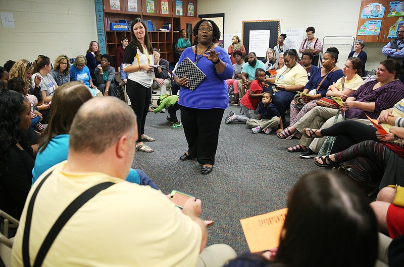 Jessica Hubbuch, a teacher at Howard High School, and Frenzica Mann, a teacher at East Lake Academy, help lead a breakout session during a Opportunity Zone initiative celebration event Tuesday, Oct. 17, 2017, at Orchard Knob Elementary School in Chattanooga, Tenn. After a short assembly, breakout groups were formed to help generate ideas for the Opportunity Zone. 