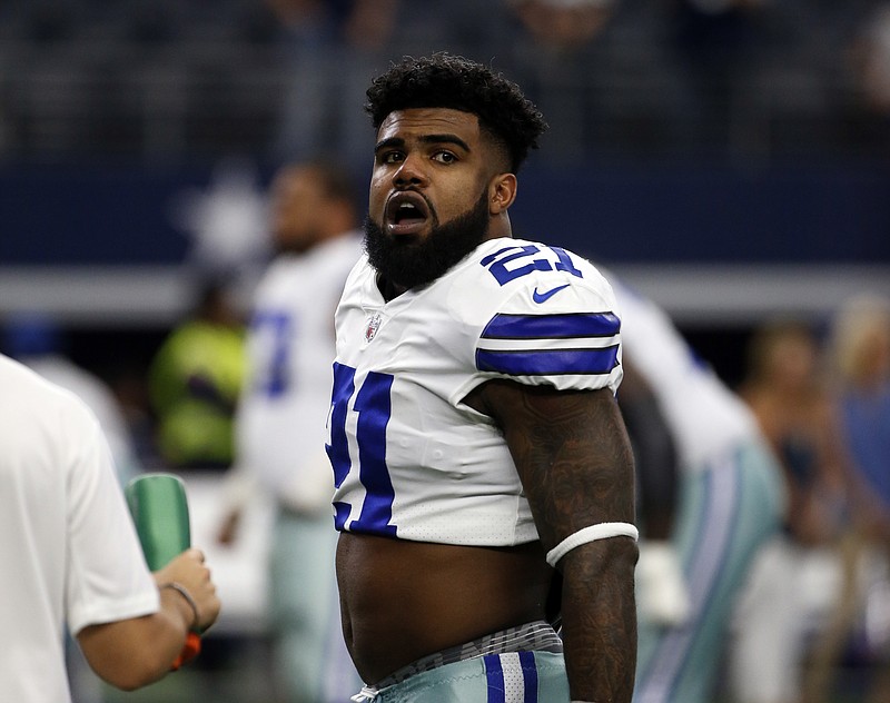 
              In this Oct. 1, 2017, photo, Dallas Cowboys' Ezekiel Elliott stands on the field during warmups before an NFL football game against the Los Angeles Rams in Arlington, Texas. Attorneys for Elliott are set for an emergency hearing in federal court in New York as they try again to stop the running back's six-game suspension over domestic violence allegations, a person with direct knowledge of the situation told The Associated Press on Monday night, Oct. 16. (AP Photo/Ron Jenkins)
            