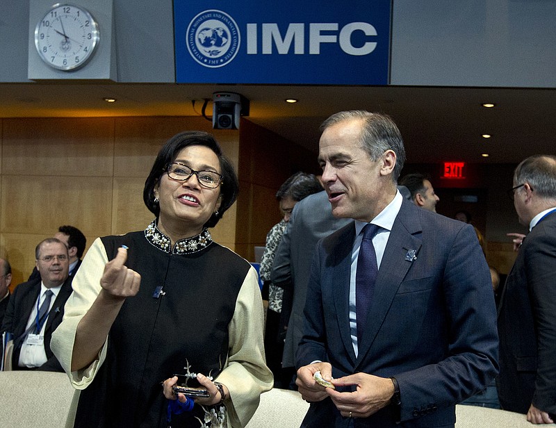 
              Indonesian Finance Minister Sri Mulyani Indrawati speaks with Bank of England Governor Mark Carney as they attend the International Monetary and Financial Committee (IMFC) conference at World Bank/IMF Annual Meetings in Washington, Saturday, Oct. 14, 2017. ( AP Photo/Jose Luis Magana)
            