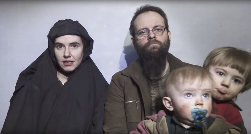 In this file image from video released by Taliban Media in December 2016, Caitlan Coleman talks in the video while her Canadian husband Joshua Boyle holds their two children. The couple and their three children were rescued Wednesday, Oct. 12, 2017, five years after the couple was abducted in Afghanistan on a backpacking trip. The children were born in captivity. (Taliban Media via AP)