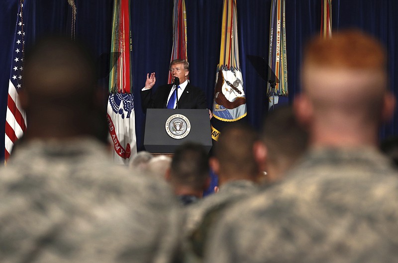 In this Aug. 21, 2017, file photo, President Donald Trump speaks at Fort Myer in Arlington Va., about U.S. strategy in Afghanistan. Trump on Oct. 17 will call the families of four soldiers killed this month in Niger, the White House says, as Trump again casts doubt on whether his predecessor appropriately consoled the families of military personnel who died in war. (AP Photo/Carolyn Kaster, File)