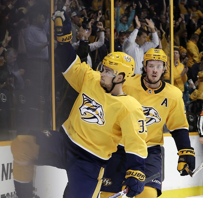 Nashville Predators left wing Viktor Arvidsson (33), of Sweden, celebrates after scoring a goal against the Colorado Avalanche in the second period of an NHL hockey game Tuesday, Oct. 17, 2017, in Nashville, Tenn. At right is center Ryan Johansen. (AP Photo/Mark Humphrey)