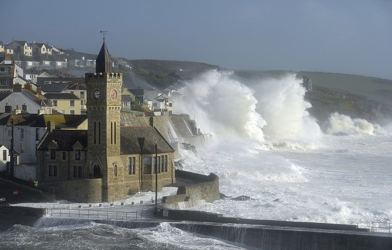 
              Waves break around the church in the harbour at Porthleven, Cornwall southwestern England, as the remnants of  Hurricane Ophelia begins to hit parts of Britain and Ireland. Ireland's meteorological service is predicting wind gusts of 120 kph to 150 kph (75 mph to 93 mph), sparking fears of travel chaos. Some flights have been cancelled, and aviation officials are warning travelers to check the latest information before going to the airport Monday.  (Ben Birchall/PA via AP)
            